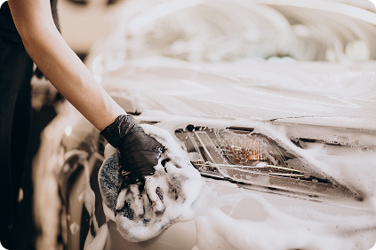 Pressure washing a white car